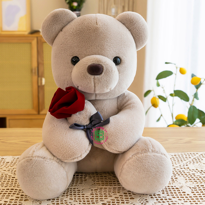 Gấu bông nhỏ hoạt hình ôm hoa hồng